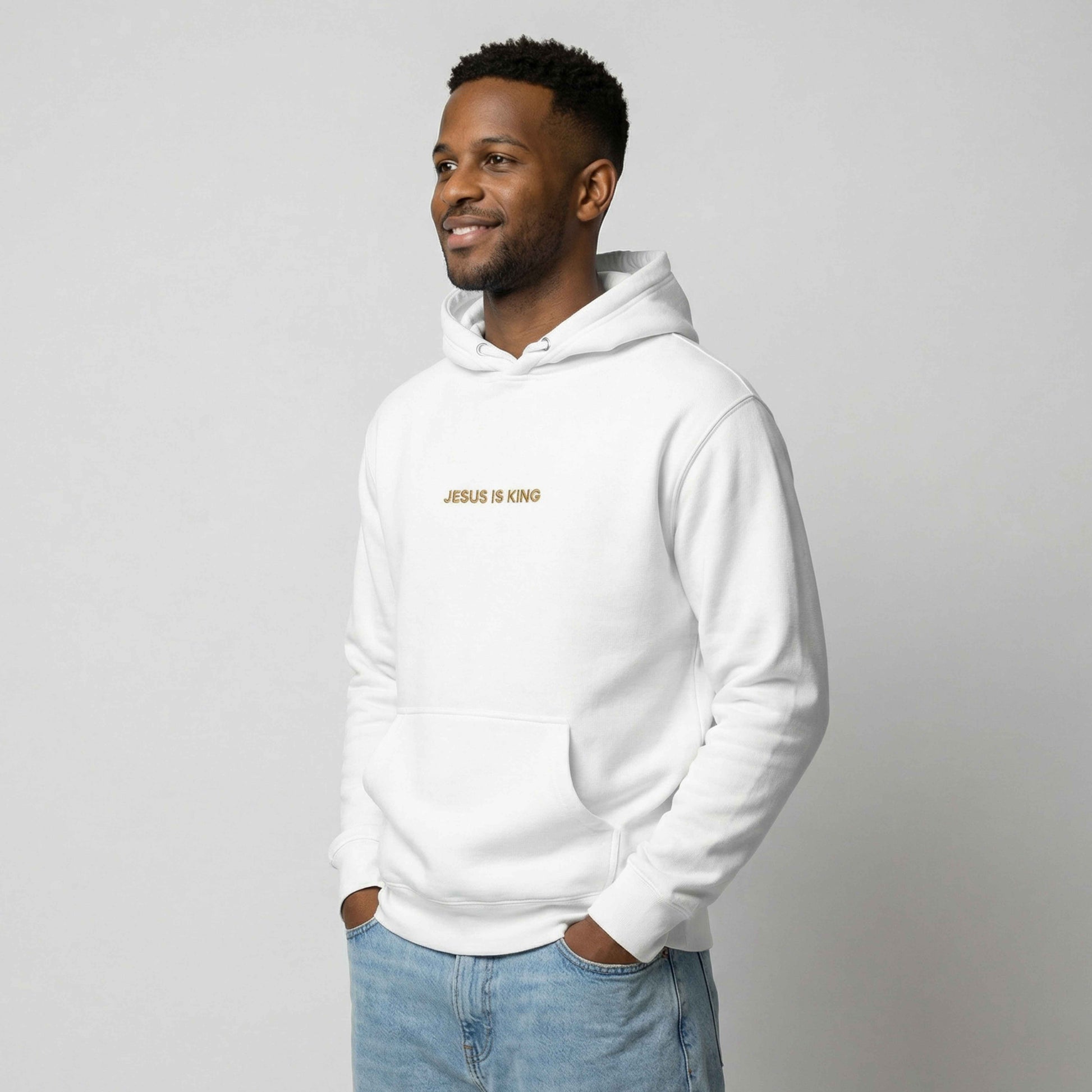 Man wearing Jesus is King Hoodie left
